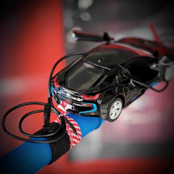 Λαμπάδα αυτοκίνητο Μαύρη Flying BMW - Χονδρική Λαμπάδα με μεταλλικό αγωνιστικό αυτοκίνητο BMW δεμένο με σουέντ και κορδόνια