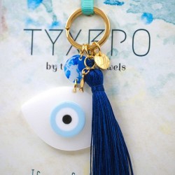 Handmade key-chain with plexiglass evil eye and silk tassel Handmade key-chain with plexiglass evil eye, gold-plated parts and silk tassel