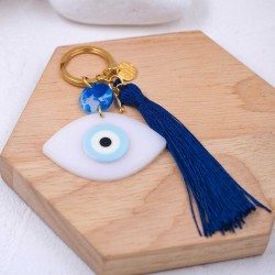 Handmade key-chain with plexiglass evil eye and silk tassel Handmade key-chain with plexiglass evil eye, gold-plated parts and silk tassel