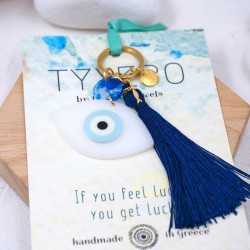 Handmade key-chain with plexiglass evil eye and silk tassel Handmade key-chain with plexiglass evil eye, gold-plated parts and silk tassel