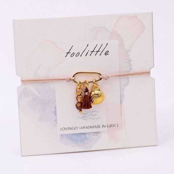 Handmade macrame bracelet with gold-plated parts and decorative card Handmade macrame bracelet with gold-plated parts and decorative card