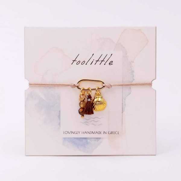 Handmade macrame bracelet with gold-plated parts and decorative card Handmade macrame bracelet with gold-plated parts and decorative card