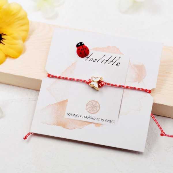 Butterfly March Bracelet March bracelet made of red-white cord with enamel butterfly
