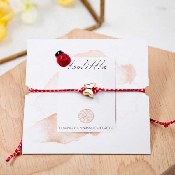 Butterfly March Bracelet March bracelet made of red-white cord with enamel butterfly