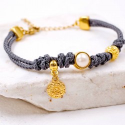 Handmade bracelet made of cord and Swarovski pearl