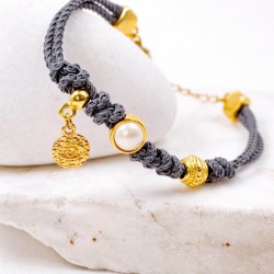 Handmade bracelet made of cord and Swarovski pearl
