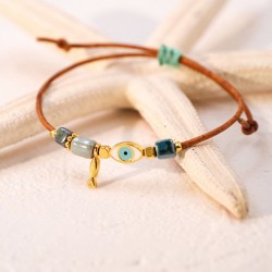 Macrame bracelet with gold-plated enamelled metal evil eye Handmade macrame bracelet with gold-plated enamelled metal evil eye