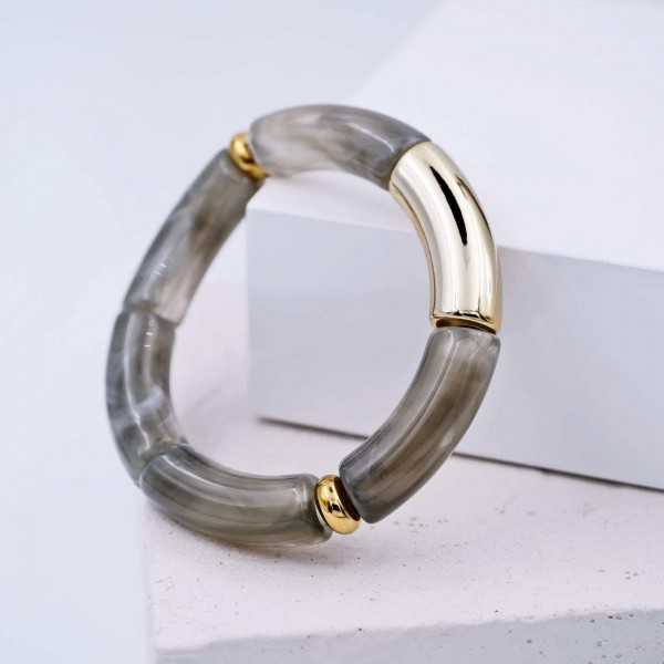 Ελαστικό βραχιόλι με στοιχεία από ακρυλικό και επίχρυσα στοιχεία Ελαστικό βραχιόλι με στοιχεία από ακρυλικό και επίχρυσα στοιχεία