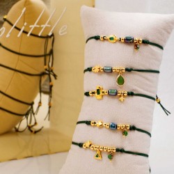 Set of 5 handmade bracelets with gold-plated parts Set of 5 handmade bracelets with gold-plated parts, ceramic beads and enamel