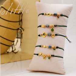 Set of 5 handmade bracelets with gold-plated parts Set of 5 handmade bracelets with gold-plated parts, ceramic beads and enamel