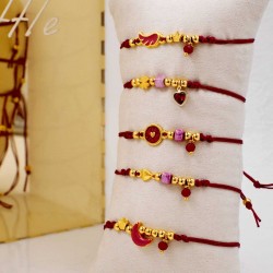 Set of 5 handmade bracelets with gold-plated parts Set of 5 handmade bracelets with gold-plated parts, ceramic beads and enamel
