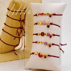 Set of 5 handmade bracelets with gold-plated parts Set of 5 handmade bracelets with gold-plated parts, ceramic beads and enamel