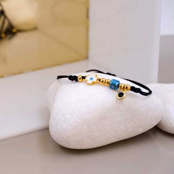 Macrame bracelet with gold-plated enamelled evil eye cross Handmade macrame bracelet with gold-plated enamelled evil eye cross