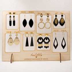 Stand with handmade pairs of earrings with gold-plating and plexiglass parts Stand with handmade pairs of earrings with gold-plating and plexiglass parts