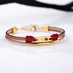 Leather 2026 lucky bracelet with metal parts in gold-plating and enamel
