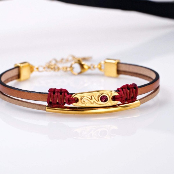 Leather 2026 lucky bracelet with metal parts in gold-plating and enamel
