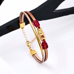 Leather 2026 lucky bracelet with metal parts in gold-plating and enamel