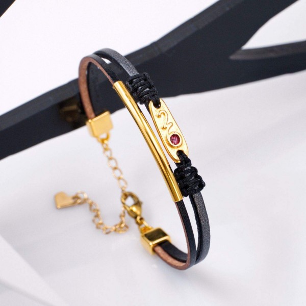 Leather 2026 lucky bracelet with metal parts in gold-plating and enamel